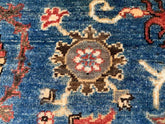 Vintage Oushak Hand Knotted Wool Rug with deep navy blue, cream, muted red, and brown floral medallions handwoven in wool