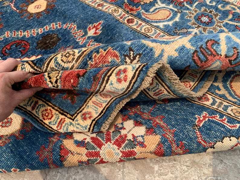 Vintage Oushak Hand Knotted Wool Rug in deep navy blue with floral medallions, botanical motifs, and ornate cream and red borders