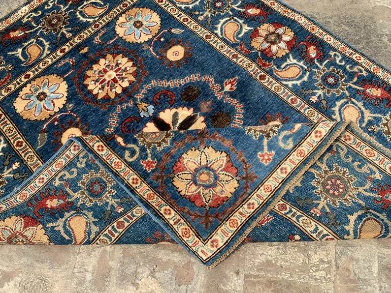 Vintage Oushak Hand Knotted Wool Rug with deep navy blue field, large floral medallions, and ornate cream border