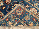 Vintage Oushak Hand Knotted Wool Rug in deep navy blue with intricate floral medallions and ornate borders in cream, red, and brown hues