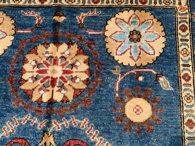 Vintage Oushak Hand Knotted Wool Rug with navy blue background, large floral medallions, botanical motifs, and ornate cream border