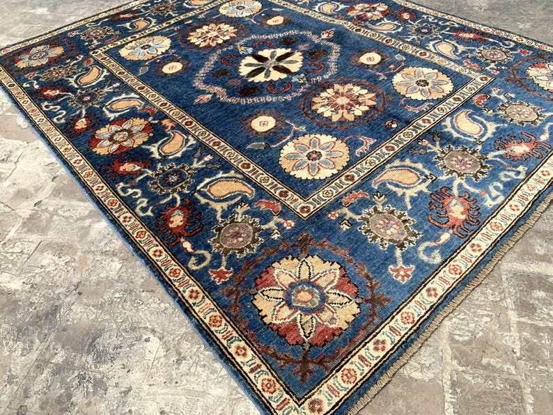 Vintage Oushak Hand Knotted Wool Rug with a navy blue field featuring large floral medallions and intricate botanical motifs in cream, ivory, red, and terracotta hues