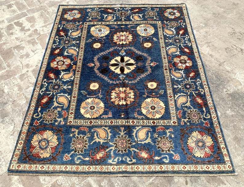 Vintage Oushak Hand Knotted Wool Rug with deep navy blue background, large floral medallions, and intricate cream and red botanical patterns