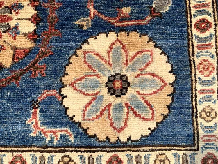 Vintage Oushak Hand Knotted Wool Rug with deep navy field, large cream floral medallions, red and blue accents, and intricate border patterns