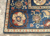 Vintage Oushak Hand Knotted Wool Rug with deep navy blue background, large floral medallions, and intricate cream and terracotta border detailing