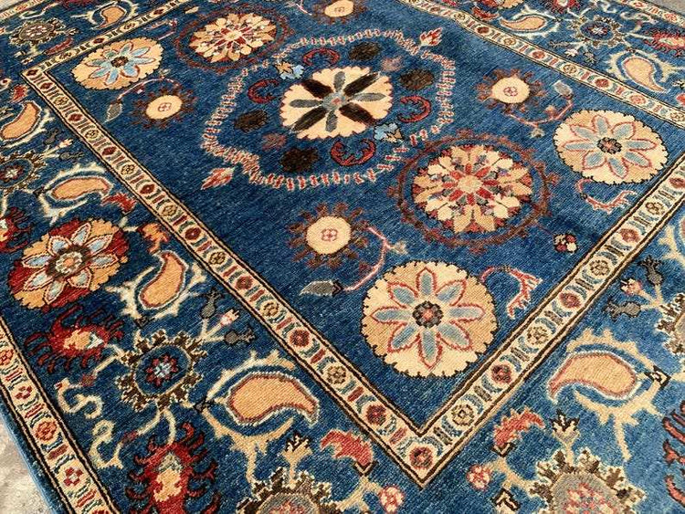 Vintage Oushak Hand Knotted Wool Rug with deep navy field, large floral medallions, intricate cream and terracotta border, and botanical motifs