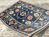 Vintage Oushak Hand Knotted Wool Rug in deep navy blue with floral medallions, botanical motifs, and ornate multi-colored border