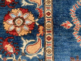 Vintage Oushak Hand Knotted Wool Rug with deep navy blue field featuring large floral medallions and intricate botanical motifs in cream, red, terracotta, and dusty blue hues